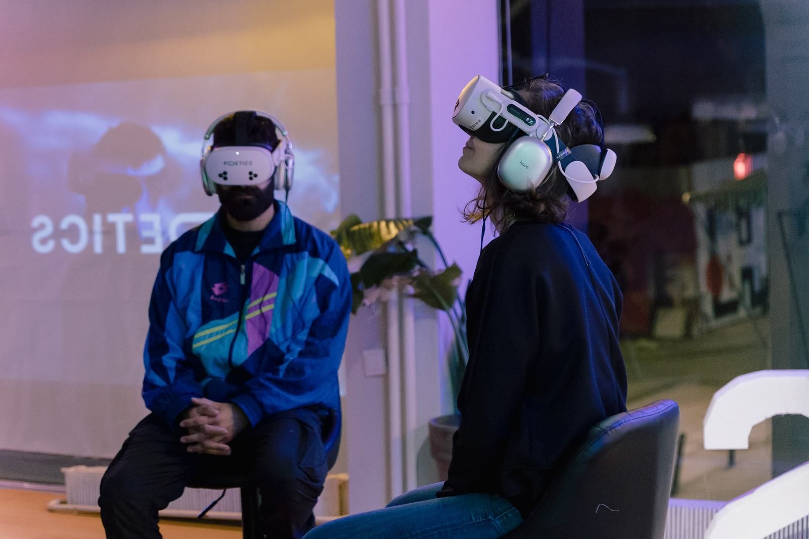 Visitors using Poetics headsets during a public gallery activation.