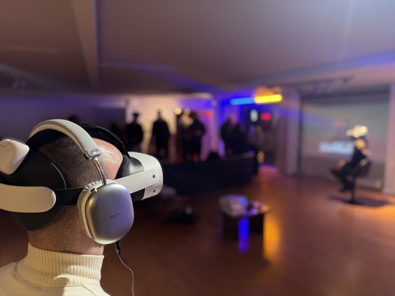 A VR cinema pop-up with several stations in a colorful venue.