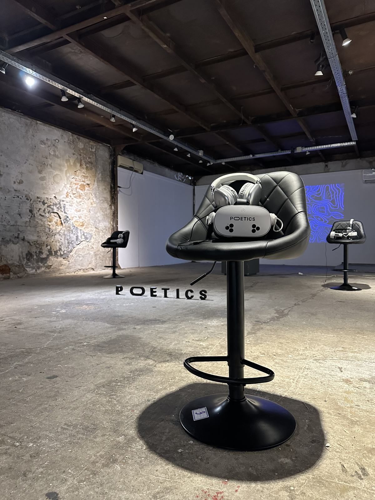 A single Poetics VR station in an industrial gallery.