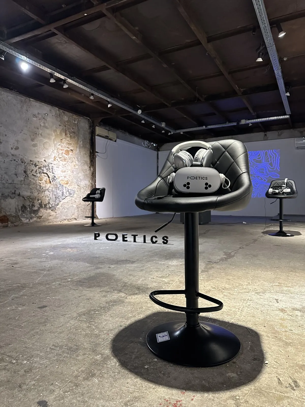 A single Poetics VR station in an industrial gallery.